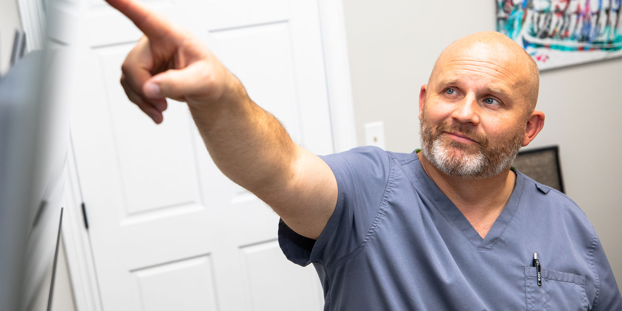 doctor going over dental procedure information with patient within the dental center